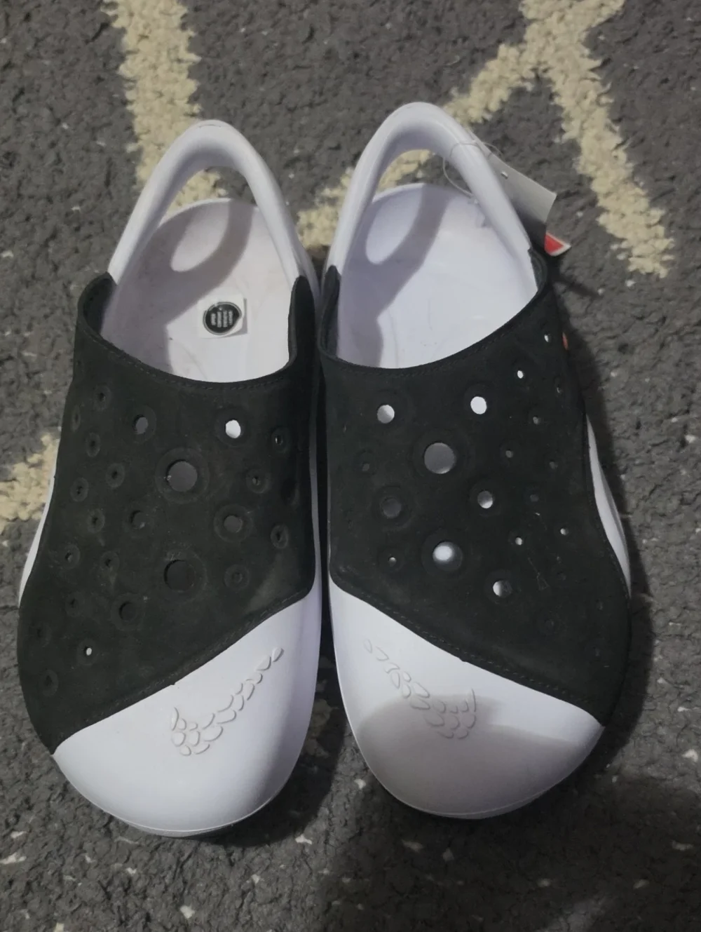 Nike Kids Black and White Slip-On Sandals with Perforated Upper